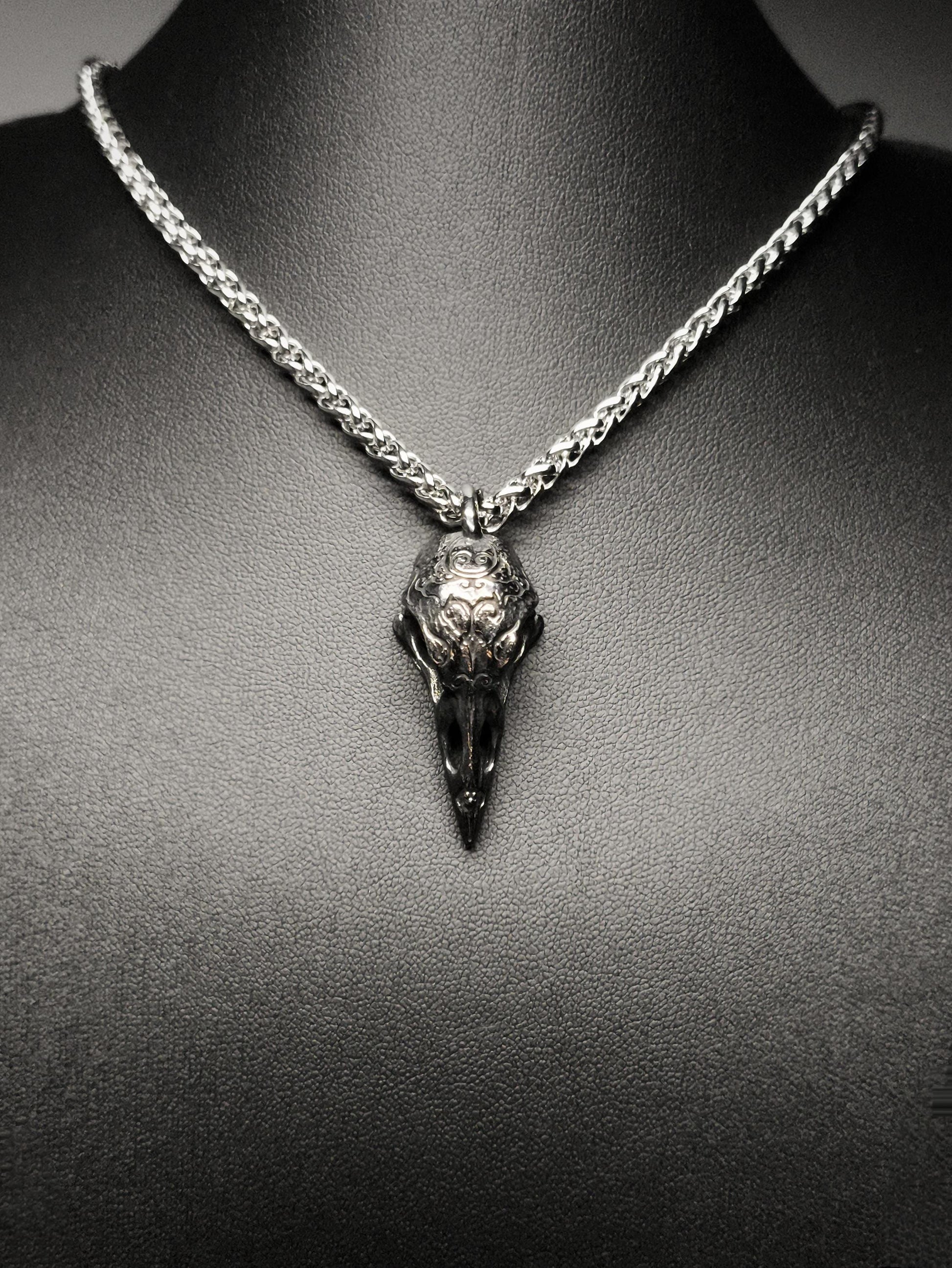 Necklace with a bird skull pendant on a mannequin